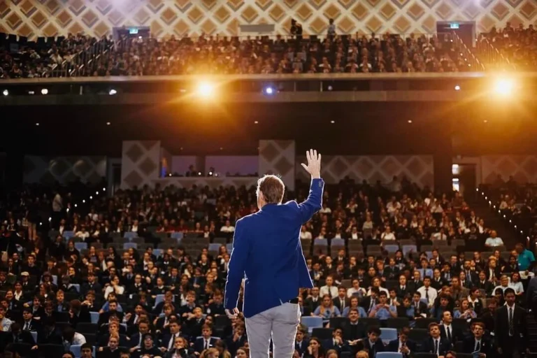 Michael-Crossland-on-stage-waving-to-the-audience